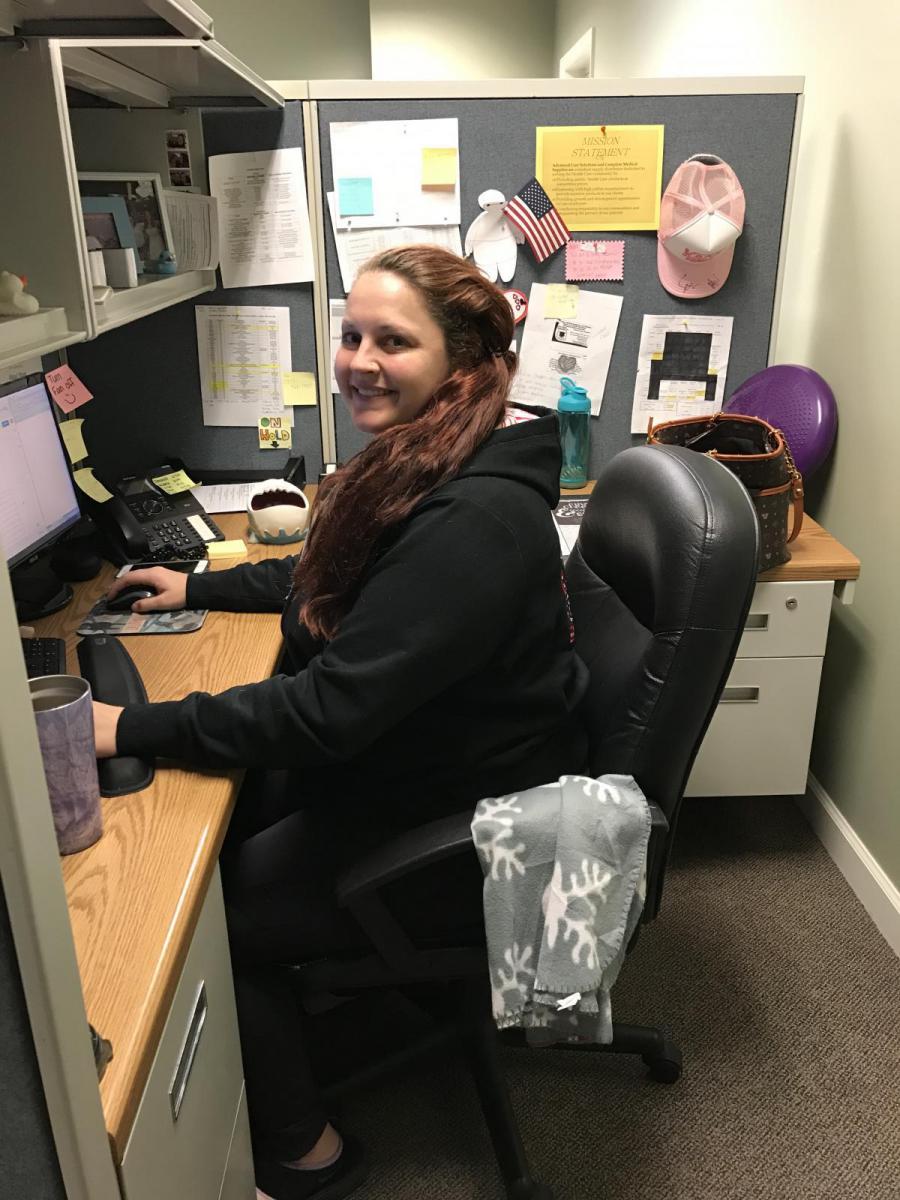 Image of Abagail Mark at her desk.