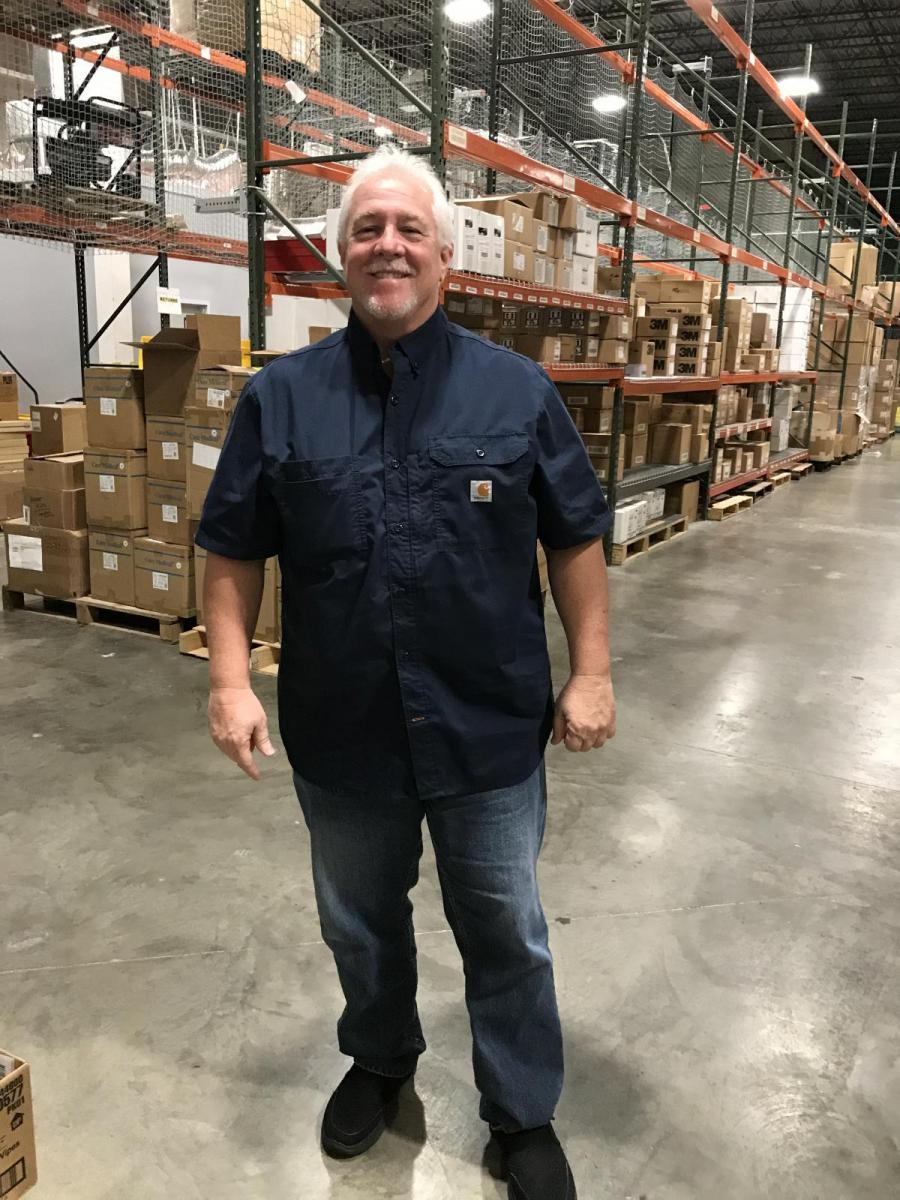Image of Steve Darrell standing inside warehouse.